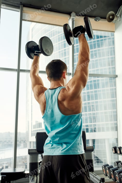 Preview: Close up of man using dumbbell exercise at gym, Sport concept