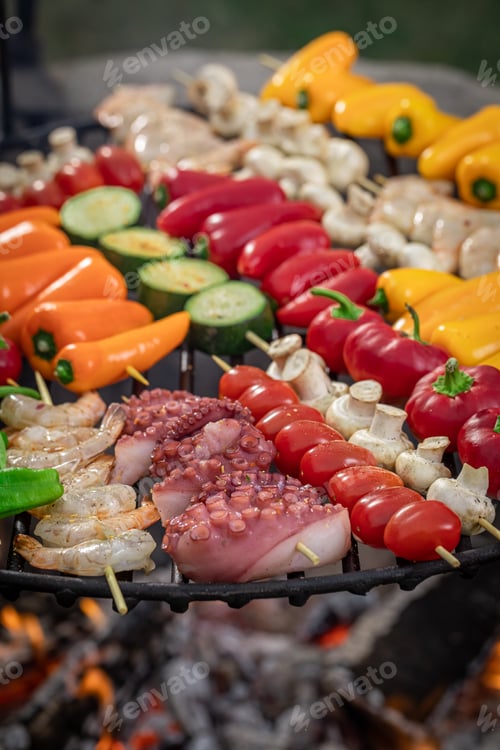 Preview: Tasty and healthy grilled shashlik on grill grate with fire.