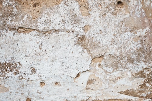 Preview: Cracked concrete wall covered with gray cement surface. Grey old wall with shabby damaged plaster or