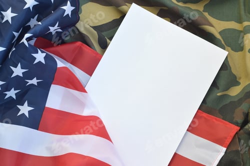 Preview: Blank paper lies on United States of America flag and folded military uniform jacket. Military