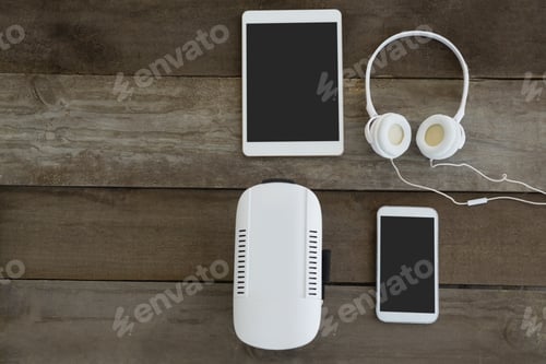 Preview: Various electronic gadgets on wooden surface