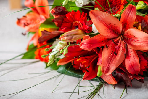 Preview: Vibrant Bouquet of orange Asiatic lilies and other flowers