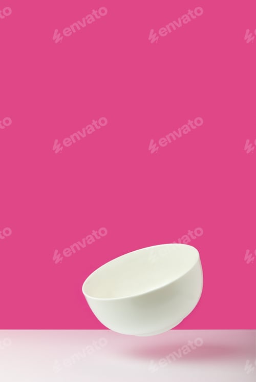 Preview: close-up view of empty white bowl on pink
