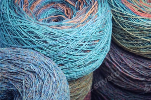 Preview: Close up of blue and brown yarn balls