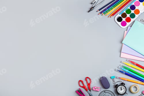 School Supplies for Learning on Gray Surface