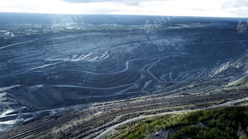 Preview: Coal mining at an open pit. Top view of the quarry. Dozers and trucks at buildings site on top