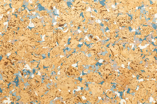 Preview: Close-up of cork sound insulation lagging with interspersing of blue paint floors and walls