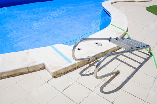 Preview: Cleaning an empty swimming pool in a residential