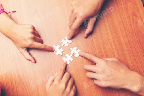 Preview: Man hands connecting couple puzzle piece in office. Business solutions, target, successful