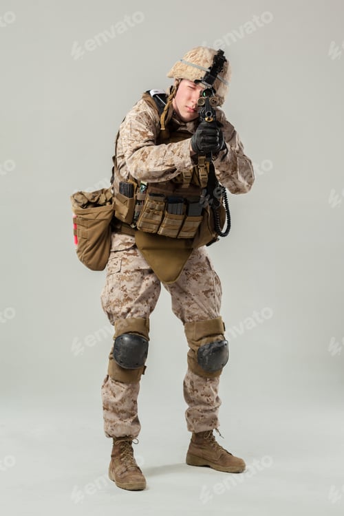 Preview: Soldier in military gear aiming weapon in neutral setting during training session