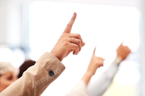 Preview: Closeup shot of a group of unrecognisable businesspeople raising their hands