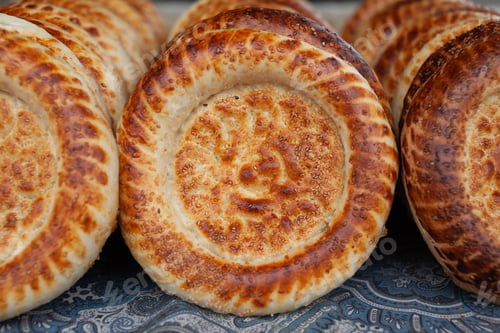 Preview: Typical traditional flatbread with crunchy crust with sesam just baked