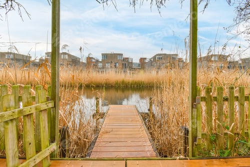 Preview: A small wooden pier leading to a river