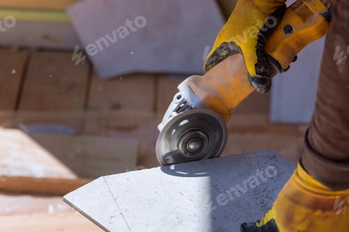 Preview: Closeup of worker use cutting machine cut a tile ceramic