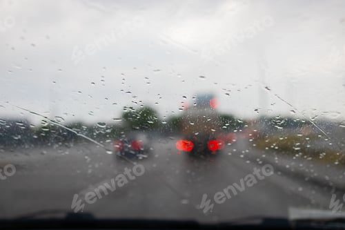 Preview: A water from rain on the window car in evening. Droplets on glass.