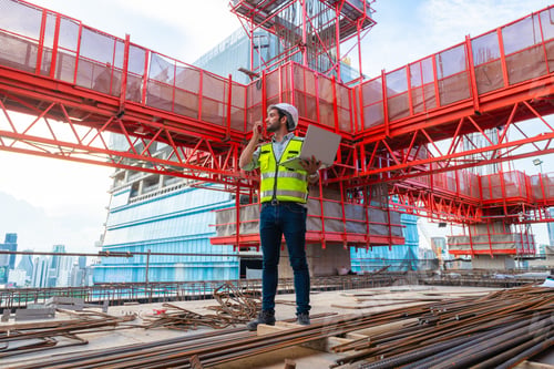 Preview: Portrait of an engineer designing a concrete floor and column structure for a shopping center.