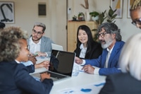 Preview: Multiracial business people working inside meeting room office using computer laptop