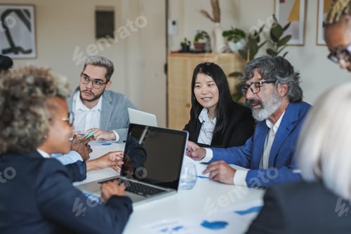 Preview: Multiracial business people working inside meeting room office using computer laptop