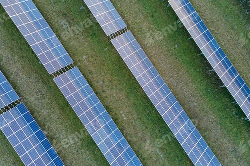 Preview: Aerial view of large sustainable electrical power plant with rows of solar photovoltaic panels