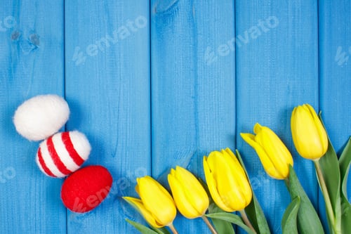 Preview: Bouquet of tulips and Easter eggs wrapped woolen string, copy space for text