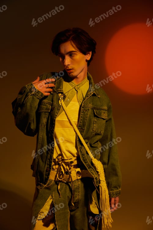 Preview: Fashionable non binary individual embraces style against vibrant sunset backdrop