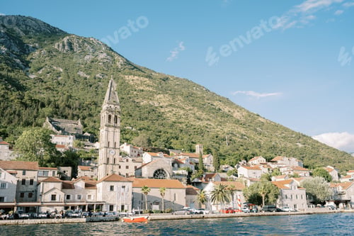 Preview: View from the sea of the ancient stone bell tower of the Church of St. Nicholas among the ancient