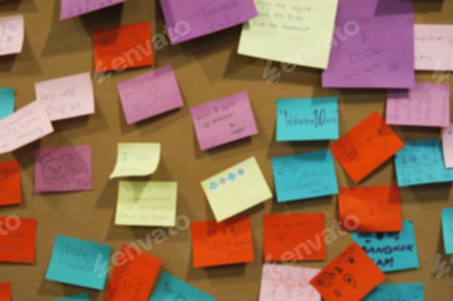 Preview: Blur of post-it note on board closeup background