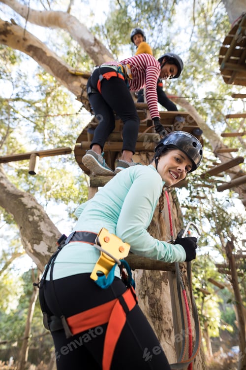Preview: Friends climbing on tree with stairs