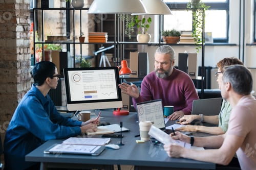Preview: Business people working in team at meeting