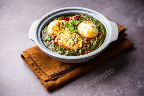 Preview: Spinach egg curry is an Indian non vegetarian dish made using palak gravy with eggs
