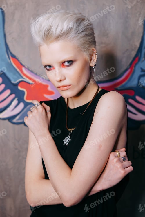 Preview: Portrait of a young fashionable blonde girl with an original hairstyle