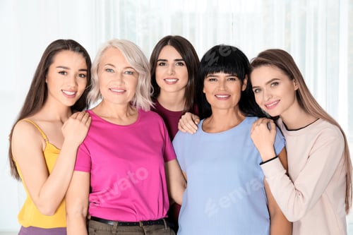 Preview: Group of ladies near window indoors. Women power concept