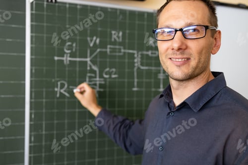 Preview: The teacher teaches how to count on the board in the classroom. Smiling man explains additions in a