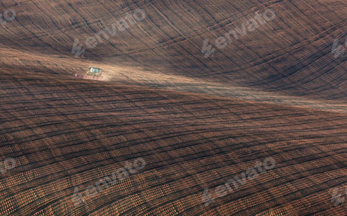 Preview: Tractor plowing a stripped field in South Moravia at sunset