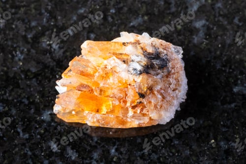 Preview: sample of rough creedite mineral on black granite