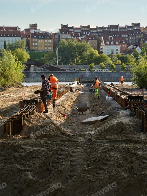 Preview: Vertical shot of an old pier under construction with workers in Warsaw, Poland