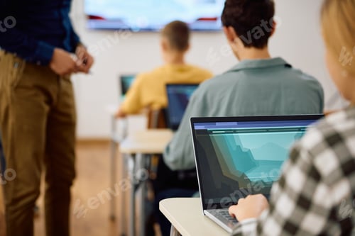 Preview: Close up of student e-learning on laptop on computer class at high school.