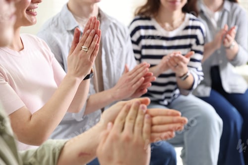 Preview: People applauding during meeting indoors, closeup view