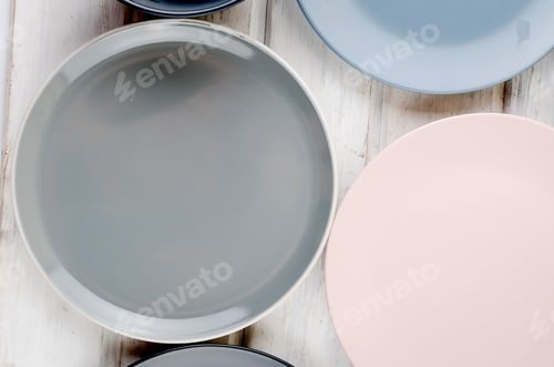 Preview: Set of clean Pastel Ceramic crockery tableware on wooden background. color bowls, dishes.