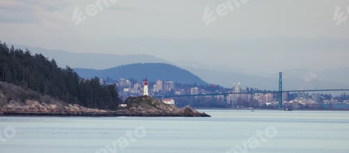 Preview: Lighthouse Park and City with Mountains in Background. Sunset