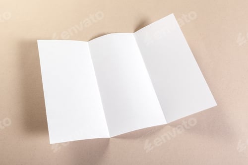 Preview: Blank folded paper on textured background ready for design or writing