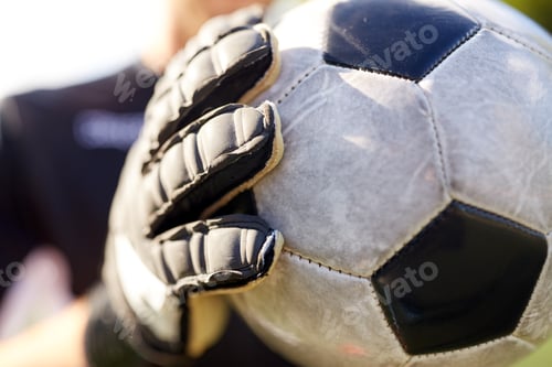 Preview: close up of goalkeeper with ball playing football