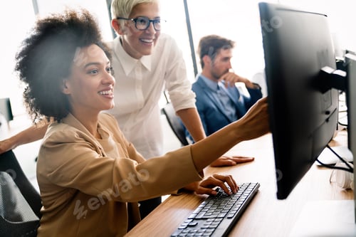 Preview: Programmers cooperating at IT company developing apps