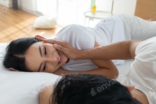 Preview: Happy Couple Relaxing Together in Bed