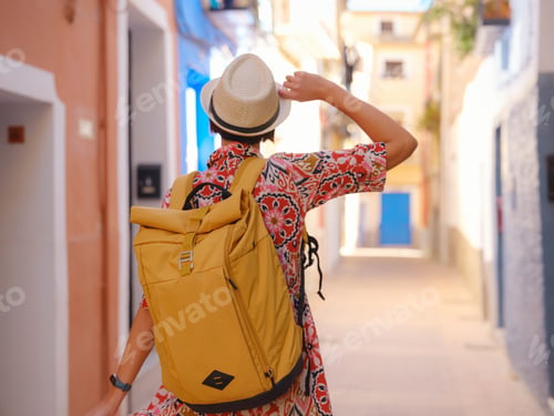 Preview: Woman strolls through colorful streets of Spanish coastal town