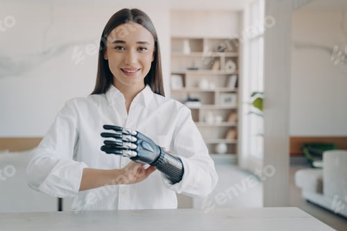 Preview: Handsome european girl has high tech carbon electronic hand. Modern technology for wellbeing.
