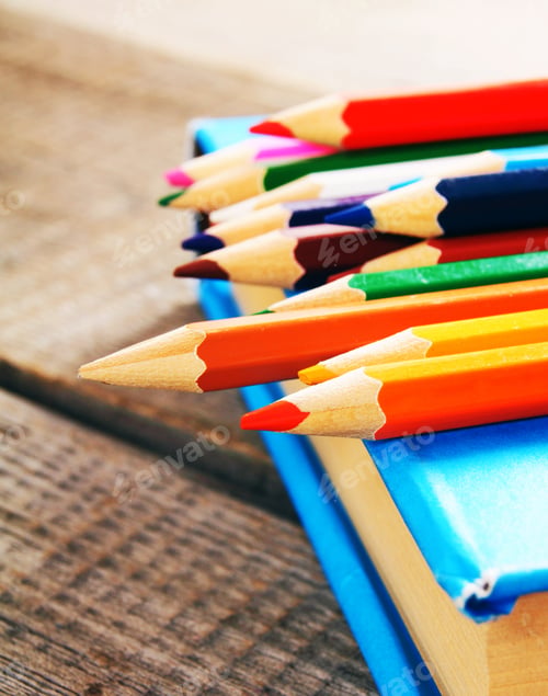 Preview: School tools. On wooden background.