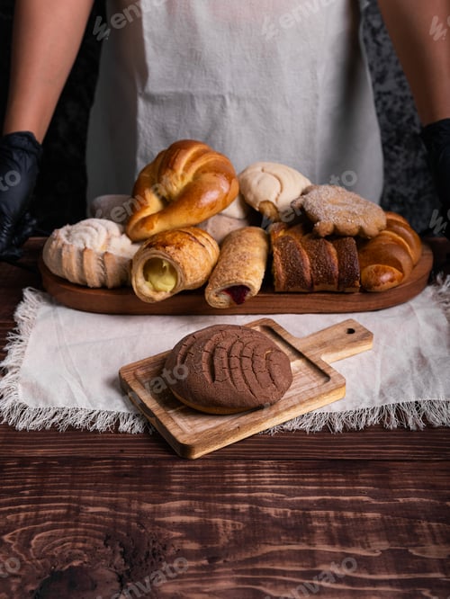 Preview: Chocolate concha bread on a rustic wooden table.