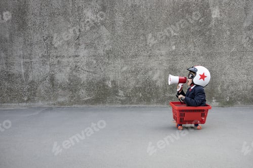 Preview: Funny businessman riding shopping cart outdoor