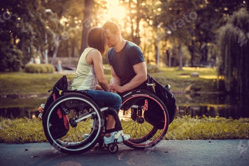 Preview: Handicapped young couple on two wheelchairs.